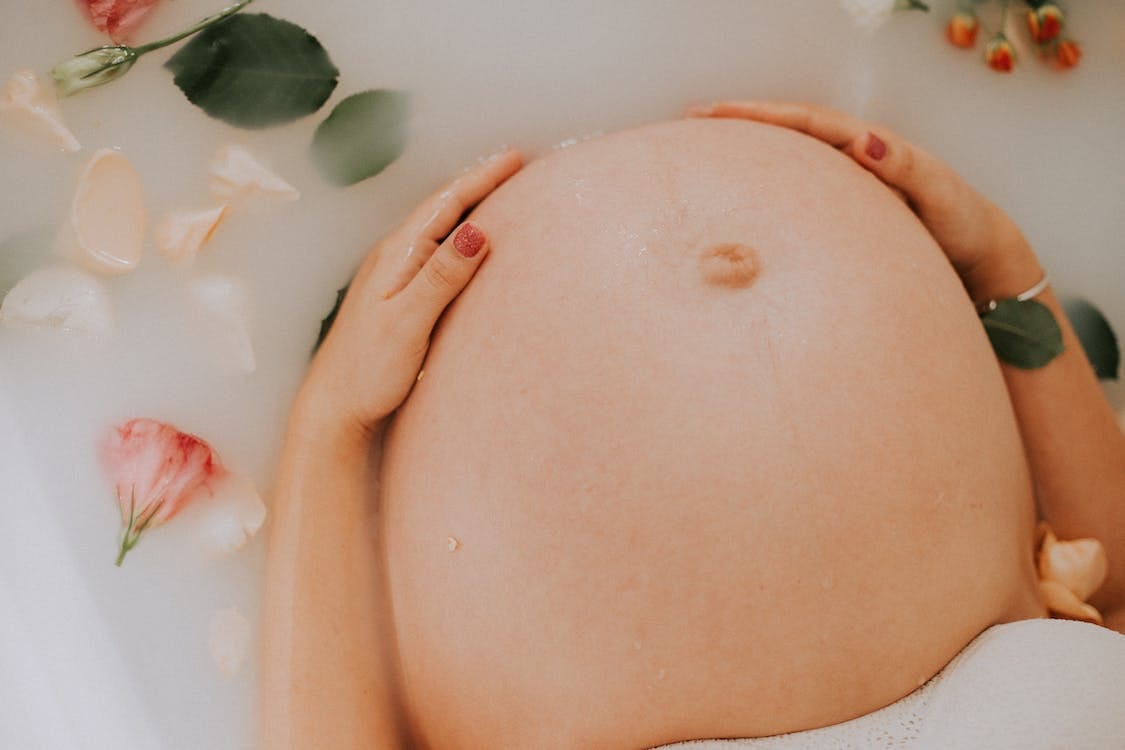 Free Pregnant Woman Sitting on Bathtub Stock Photo Free Pregnant Woman Sitting on Bathtub Stock Photo