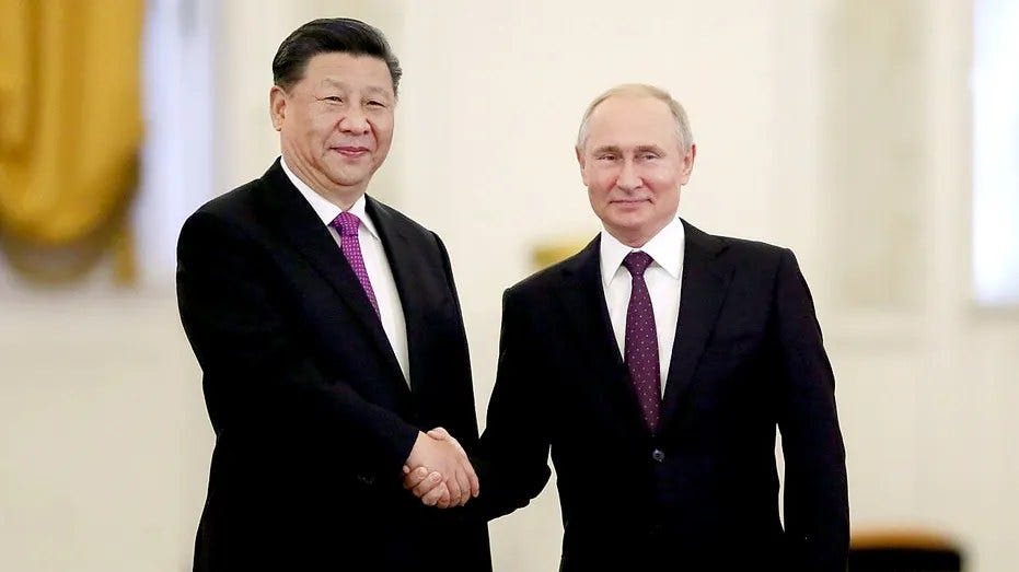 May be an image of 2 people, people standing and suit