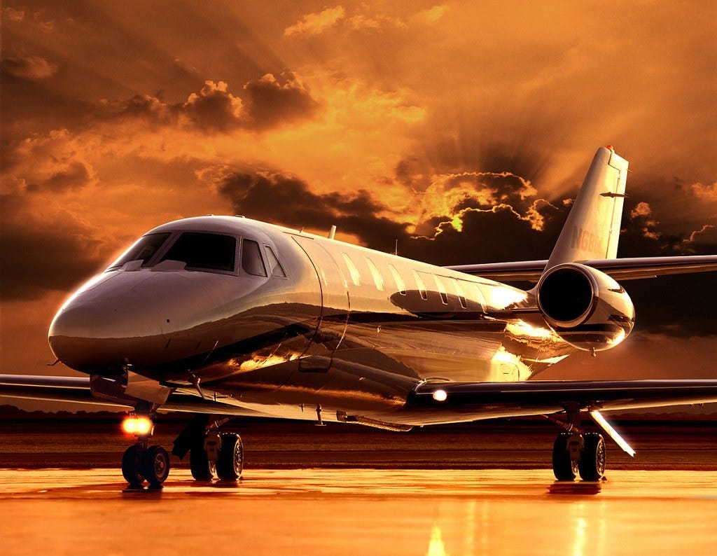 Dramatic picture of a parked private jet in front of a beautiful sunset ... on a beach? I suspect Photoshop may have been involved. Dramatic picture of a parked private jet in front of a beautiful sunset ... on a beach? I suspect Photoshop may have been involved.