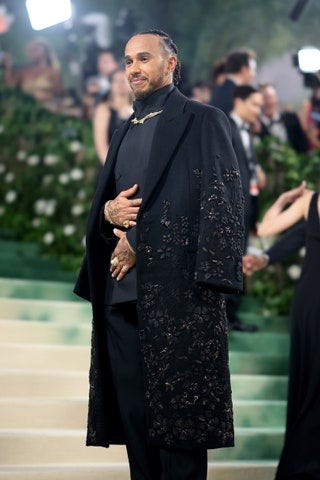 Image may contain Lewis Hamilton Person Accessories Jewelry Ring Necklace Adult Clothing Footwear Shoe and Coat