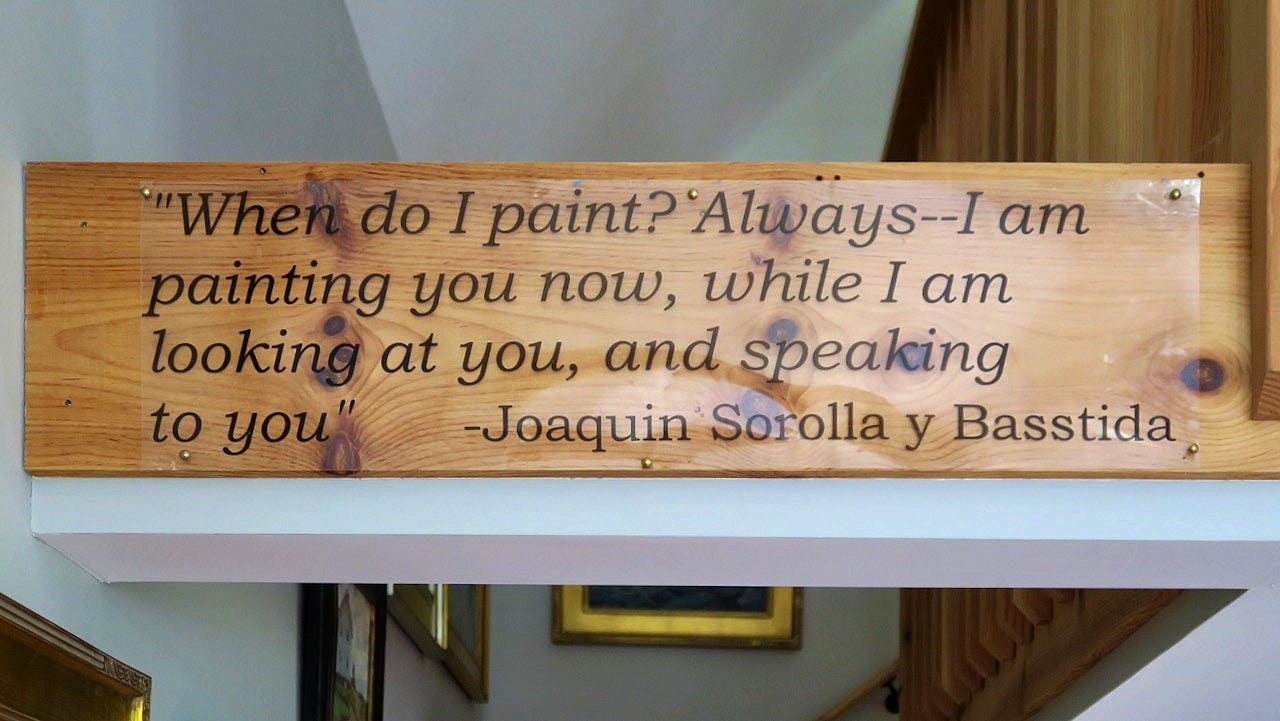 A wooden sign with black text

Description automatically generated