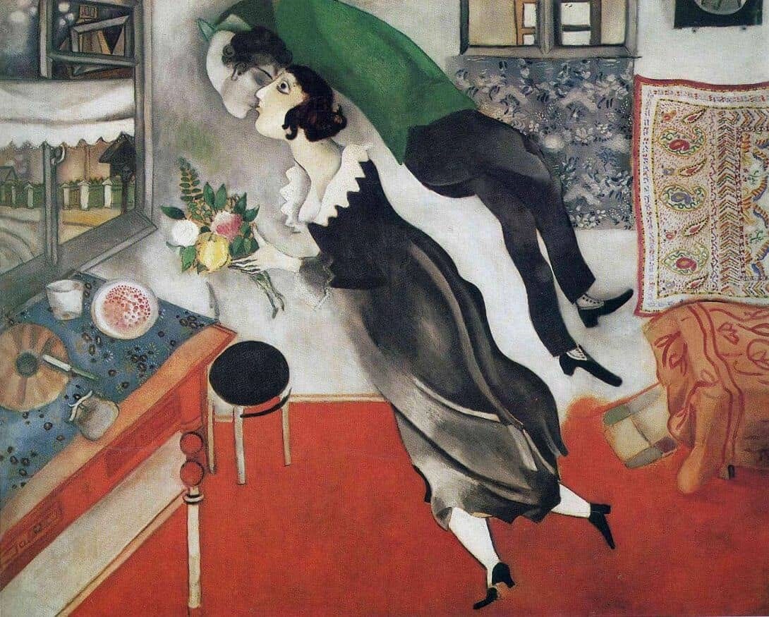 Levitating man kissing woman holding flowers