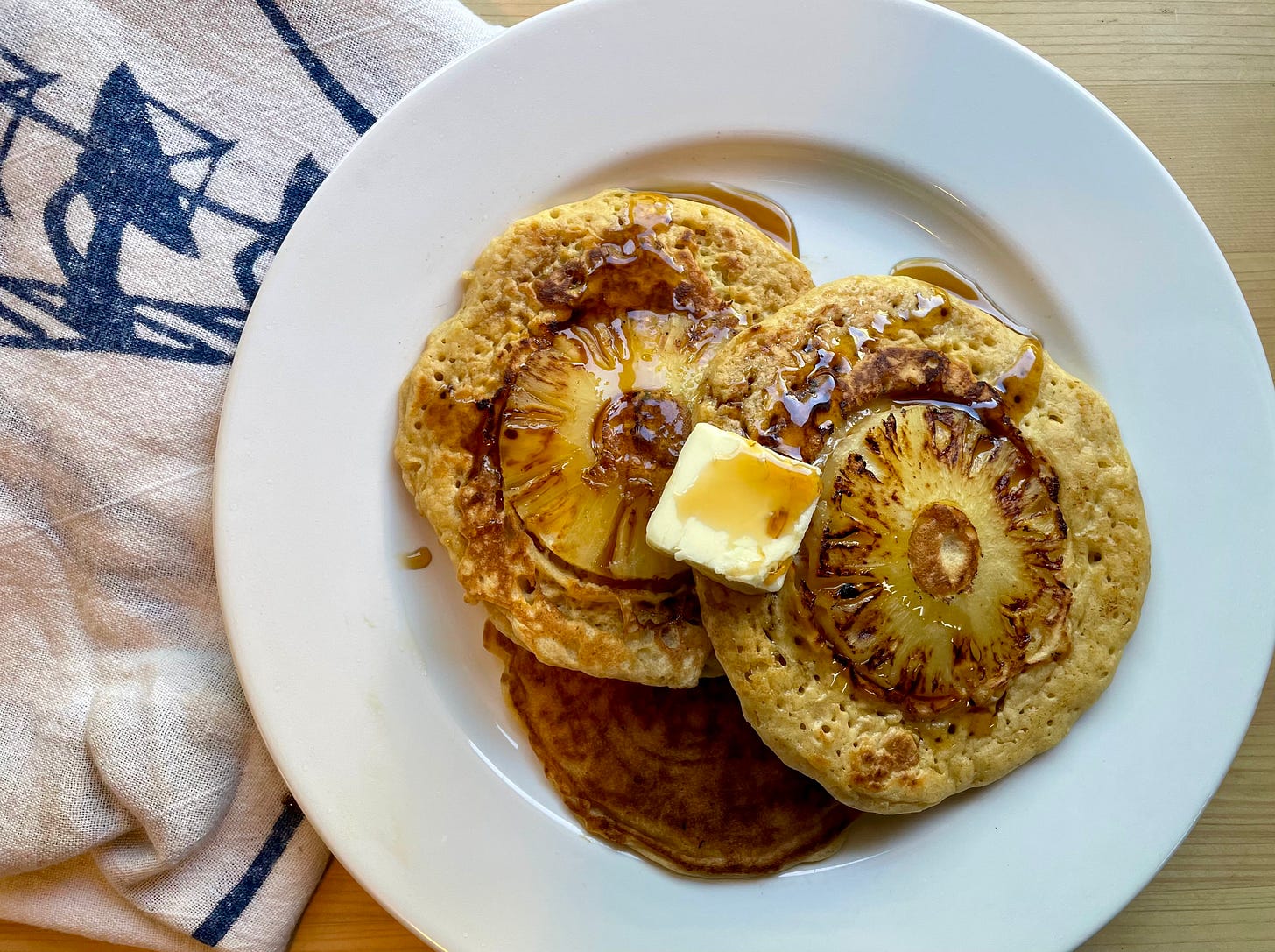 pancakes with a pineapple slice cooked into each