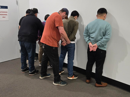 Four cruise ship crew members are arrested by US Customs & Border Protection officers at Port Everglades, Florida on April 20, 2026 (CBP photo)