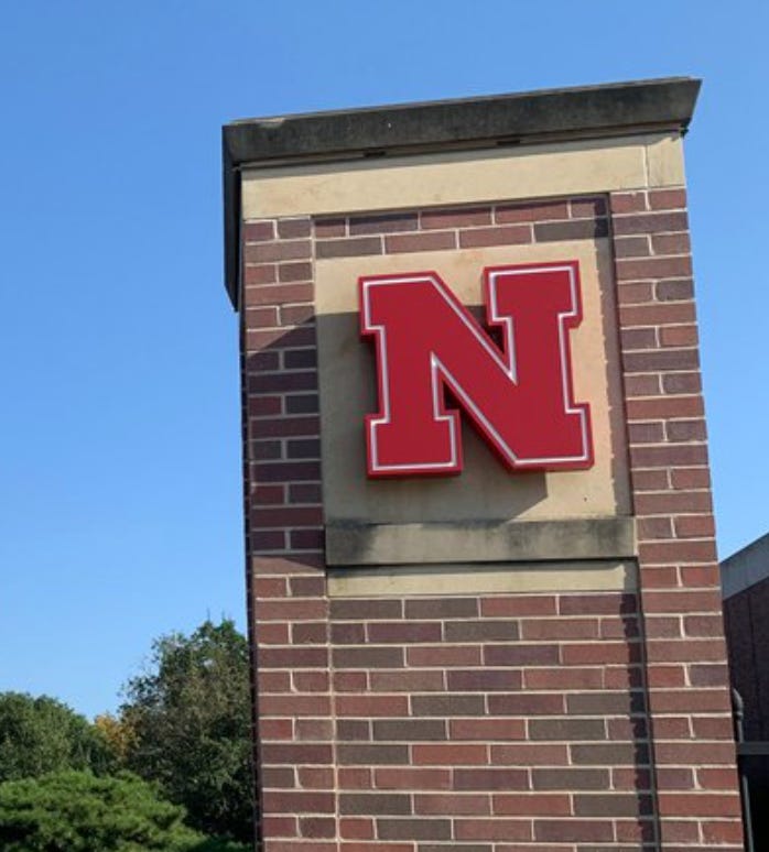 A brick pillar with the Nebraska N on it