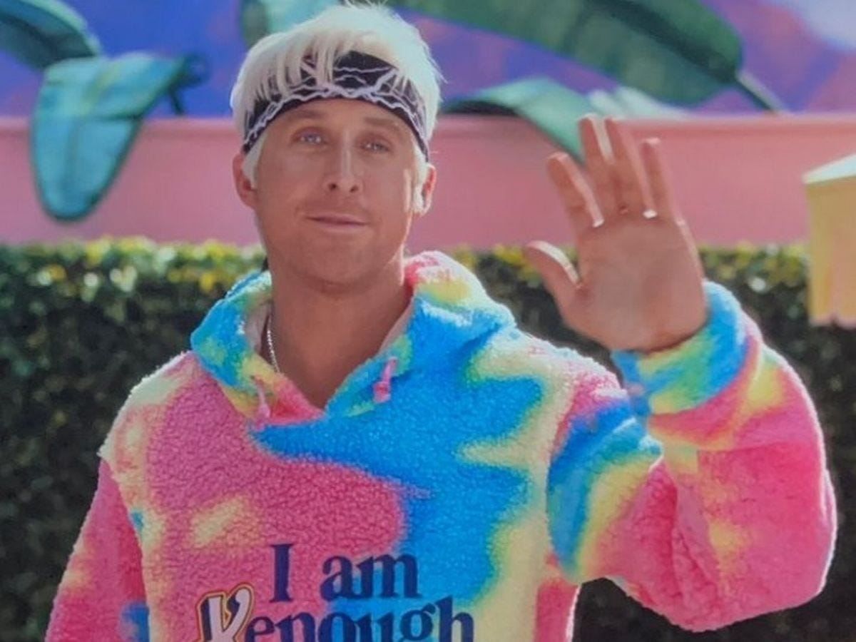 Ken wistfully waves goodbye wearing the gorgeous hoodie.