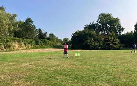 Different views of the course, including a narrow section and a sign marking straight on after one lap, right to the finish after the second