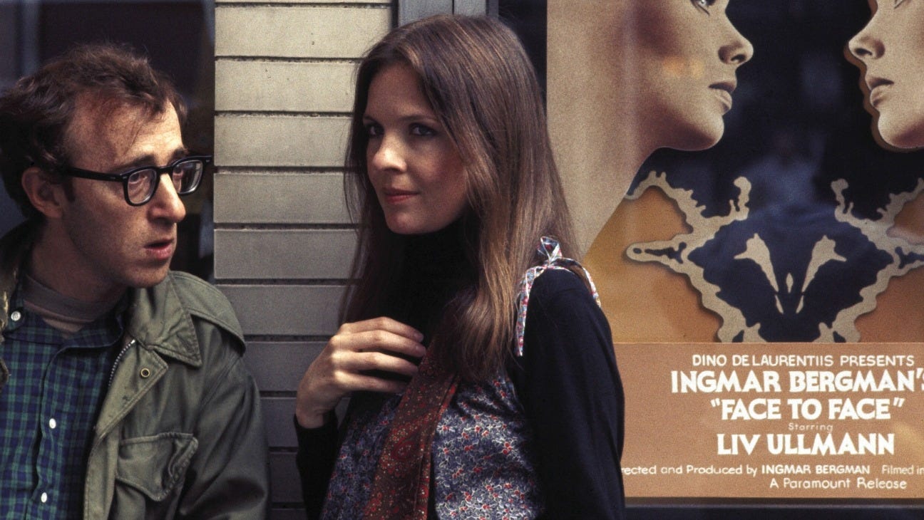 Woody Allen and Diane Keaton in front of a poster for Ingmar Bergman's 'Face to Face'