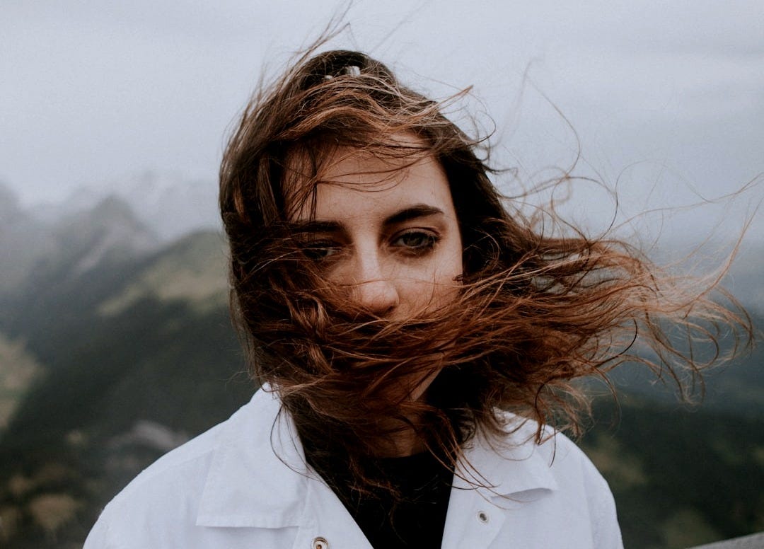 woman in white collared top