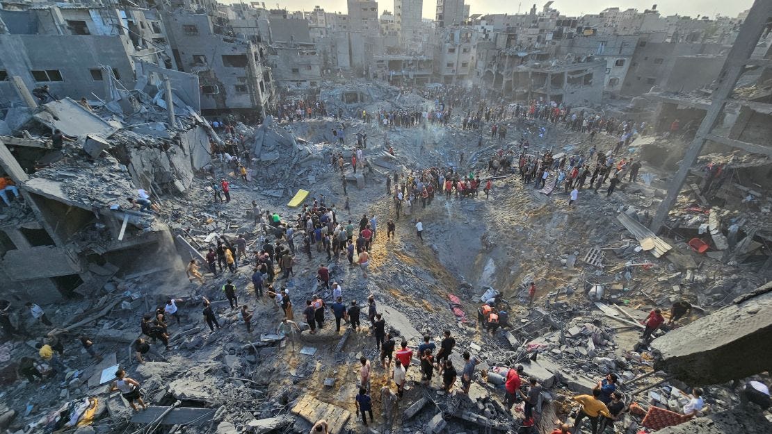 Image shows Jabalia refugee camp after Israeli airstrikes, destroyed buildings, rubble and large craters in the ground.