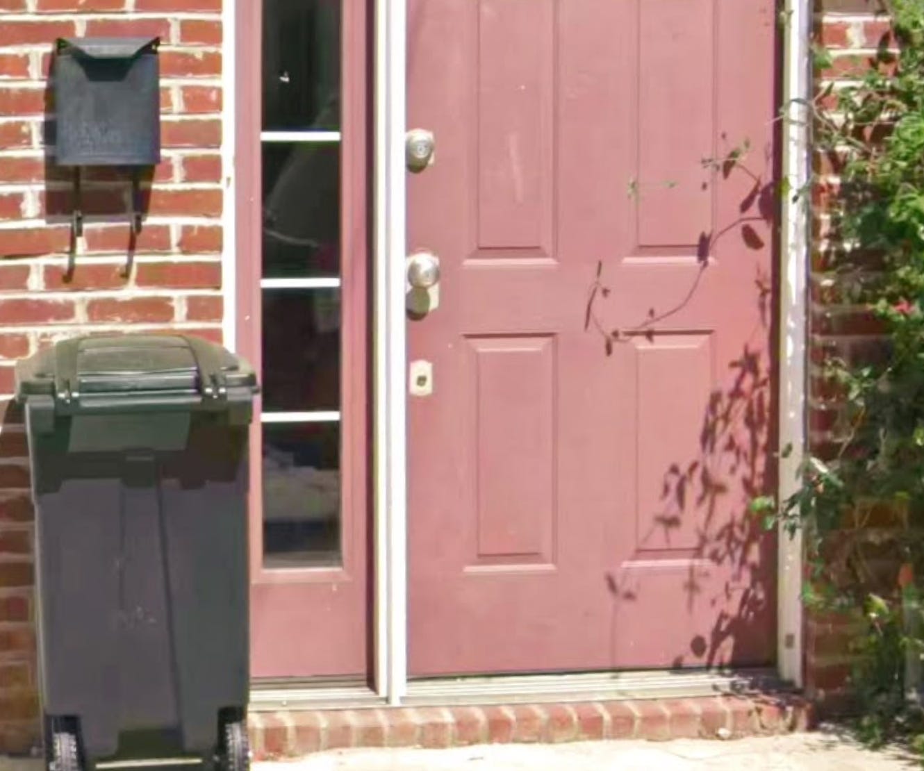 A photo of a Manayunk home's entryway, with a ledge just before the door.