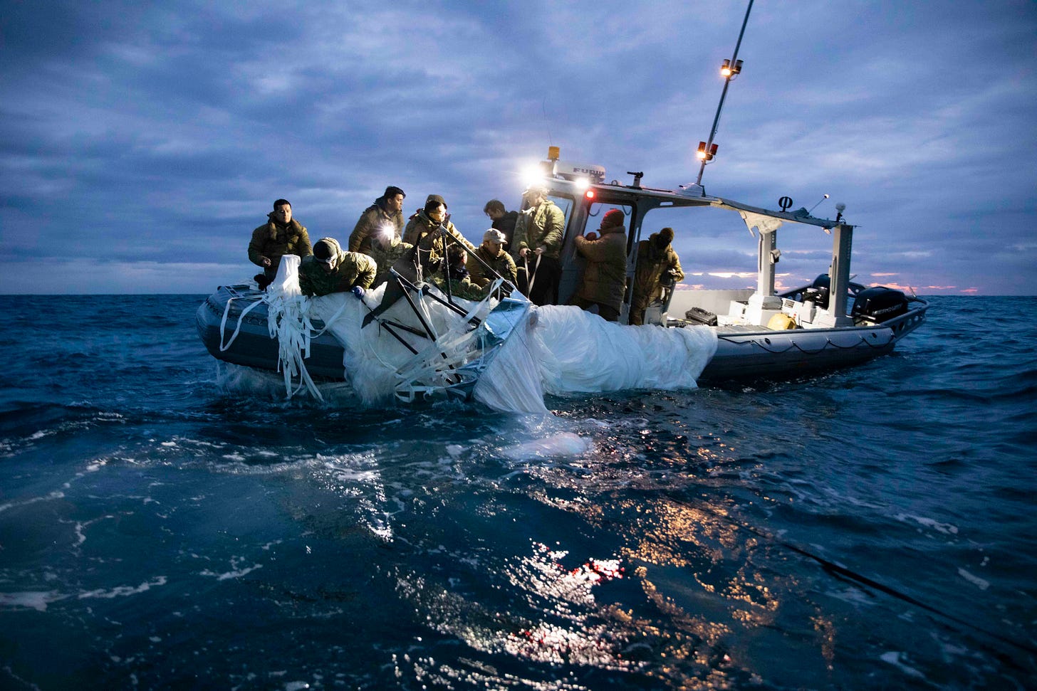 Sailors assigned to Explosive Ordnance Disposal Group 2 recover a high-altitude surveillance balloon off the coast of Myrtle Beach, South Carolina, Feb. 5, 2023. EODGRU 2 is a critical part of the Navy Expeditionary Combat Force that clears explosive hazards to provide access to denied areas; secures the undersea domain for freedom of movement; builds and fosters relationships with trusted partners, and protects the homeland. At the direction of the President of the United States and with the full support of the Government of Canada, U.S. fighter aircraft under U.S. Northern Command authority engaged and brought down a high altitude surveillance balloon within sovereign U.S. airspace and over U.S. territorial waters Feb. 4, 2023. Active duty, Reserve, National Guard, and civilian personnel planned and executed the operation, and partners from the U.S. Coast Guard, Federal Aviation Administration, and Federal Bureau of Investigation ensured public safety throughout the operation and recovery efforts. (U.S. Navy Photo by Mass Communication Specialist 1st Class Tyler Thompson) Sailors assigned to Explosive Ordnance Disposal Group 2 recover a high-altitude surveillance balloon off the coast of Myrtle Beach, South Carolina, Feb. 5, 2023. EODGRU 2 is a critical part of the Navy Expeditionary Combat Force that clears explosive hazards to provide access to denied areas; secures the undersea domain for freedom of movement; builds and fosters relationships with trusted partners, and protects the homeland. At the direction of the President of the United States and with the full support of the Government of Canada, U.S. fighter aircraft under U.S. Northern Command authority engaged and brought down a high altitude surveillance balloon within sovereign U.S. airspace and over U.S. territorial waters Feb. 4, 2023. Active duty, Reserve, National Guard, and civilian personnel planned and executed the operation, and partners from the U.S. Coast Guard, Federal Aviation Administration, and Federal Bureau of Investigation ensured public safety throughout the operation and recovery efforts. (U.S. Navy Photo by Mass Communication Specialist 1st Class Tyler Thompson)