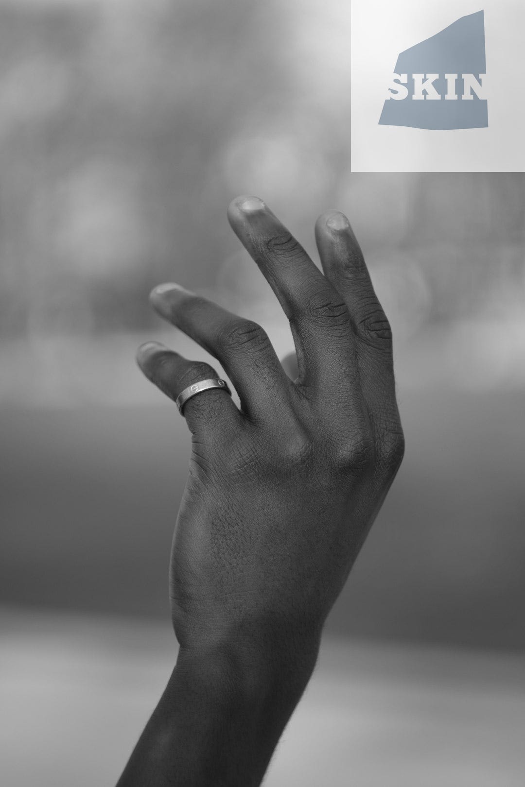 grayscale photo of persons left hand