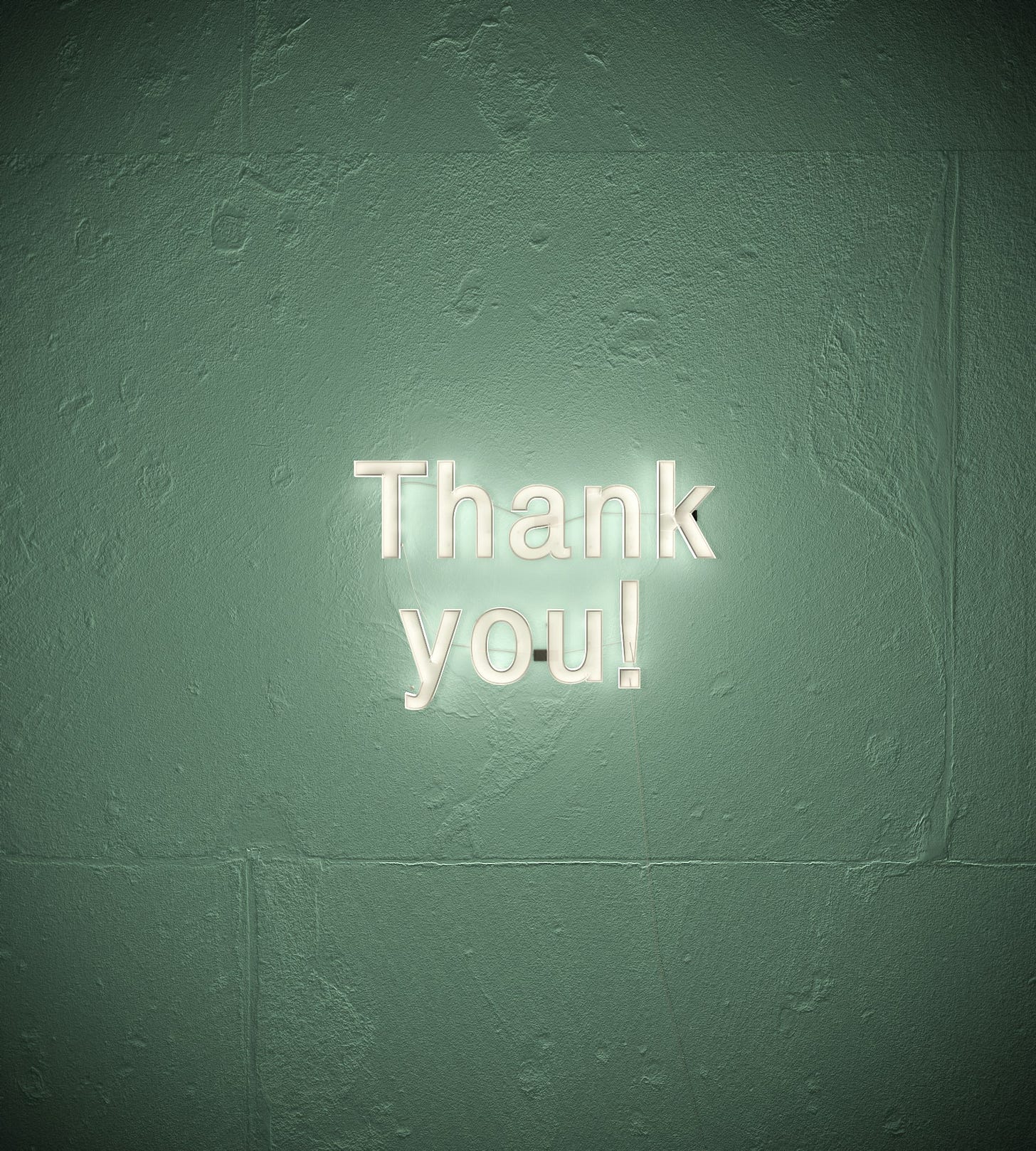 A white neon sign that says "Thank you" on a wall with hints of green. 