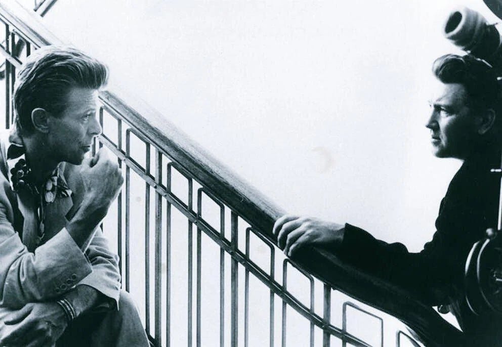 May be a black-and-white image of 2 people May be a black-and-white image of 2 people