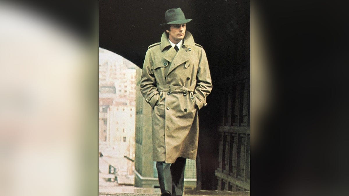 The Sultry Saga of the Trench Coat: Mud, Mystery, and Elegance Beneath the Belt