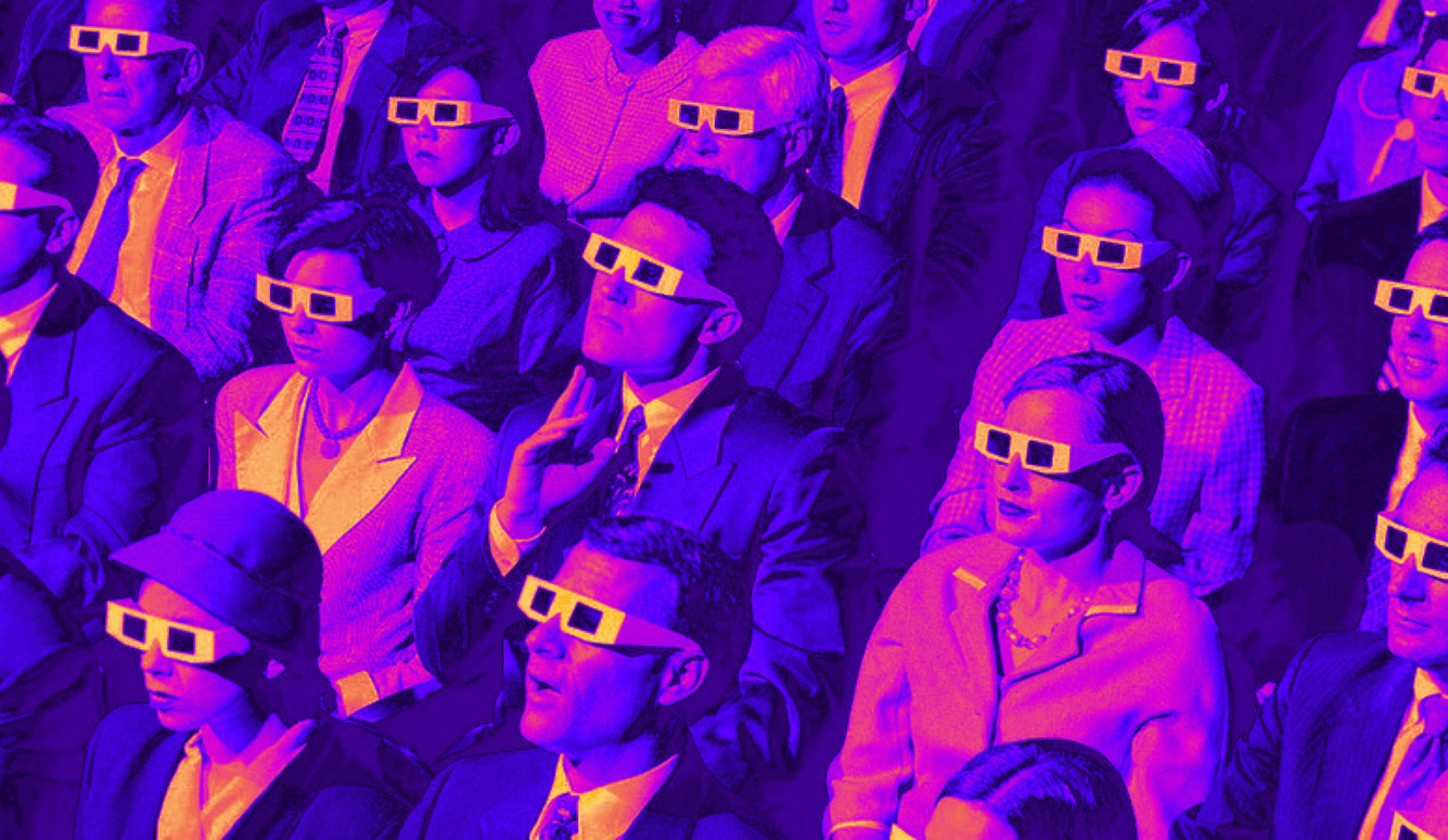 Stylised image of a seated cinema audience wearing 3D glasses, dressed in mid-20th-century formal clothing under purple lighting. Stylised image of a seated cinema audience wearing 3D glasses, dressed in mid-20th-century formal clothing under purple lighting.