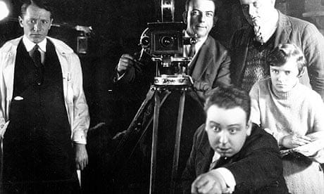 Alfred Hitchcock on the set of The Mountain Eagle (1926), with his future wife Alma Reville behind