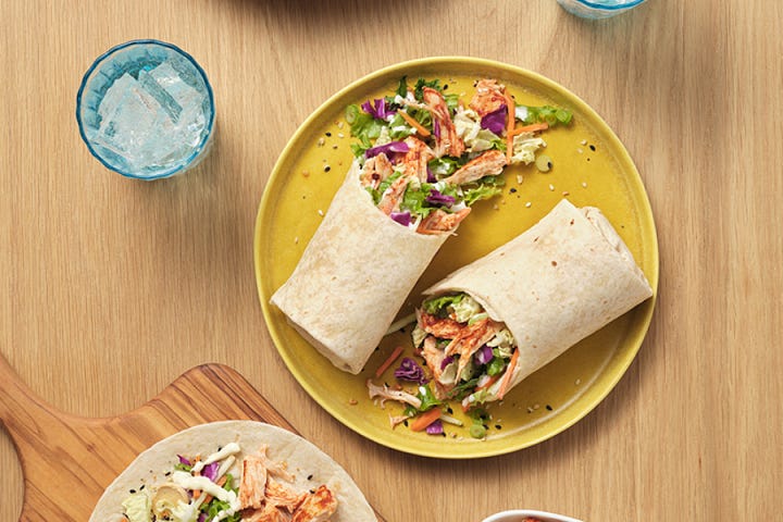 plate of easy Tostadas, a spring roll bowl with peanut sauce, goodies boxed Mac and cheese, Taylor Farms salad wrap, easy recipes made in 30 minutes