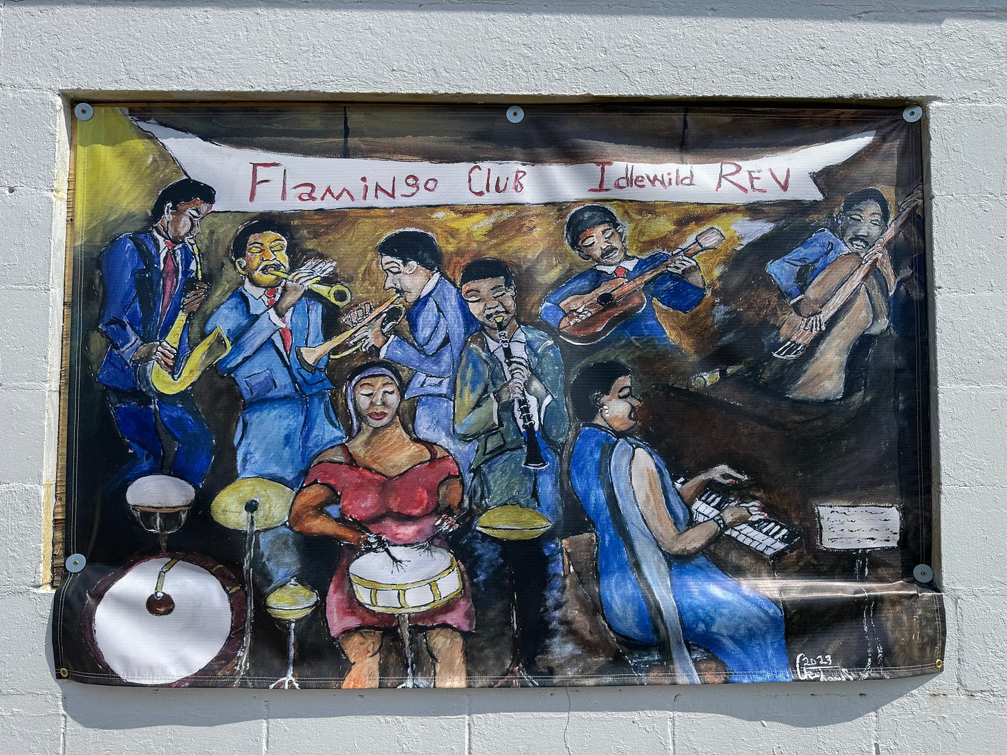 One of several banners on display at Idlewild, this one featuring a painting of a jazz band of yore. A banner above them says Flamingo Club Idlewild.