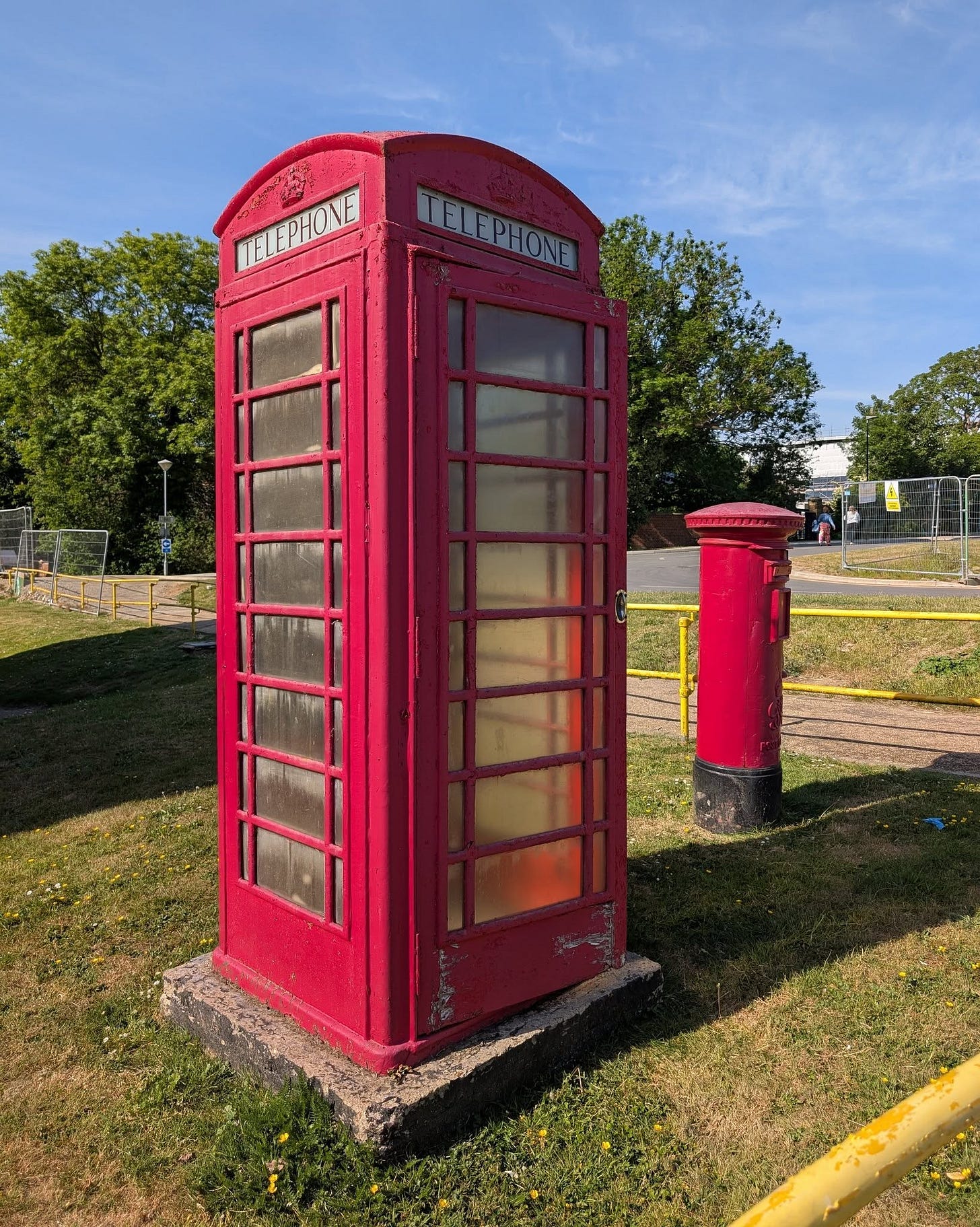 May be an image of 1 person, phone and text