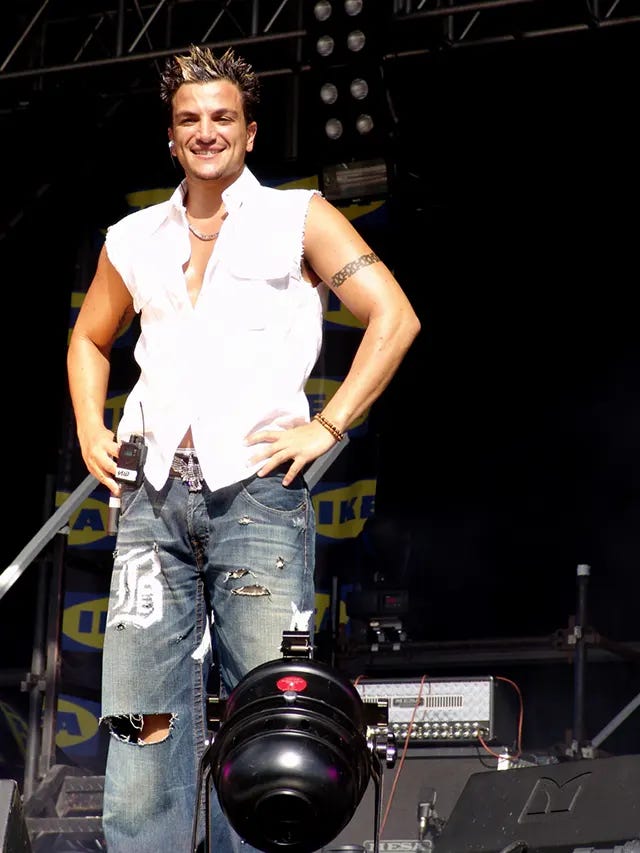 Peter Andre in 2004, sporting the era's ripped and sandblasted baggy jeans, a nod to prevalent surfer and hip-hop fashion. Peter Andre in 2004, sporting the era's ripped and sandblasted baggy jeans, a nod to prevalent surfer and hip-hop fashion.