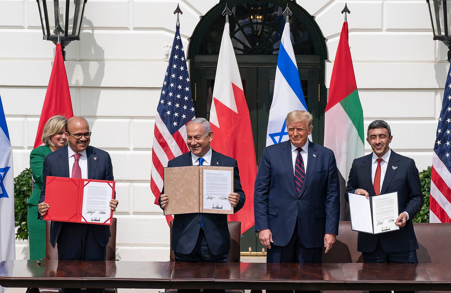 President Donald J. Trump, Minister of Foreign Affairs of Bahrain Dr. Abdullatif bin Rashid Al-Zayani, Israeli Prime Minister Benjamin Netanyahu and Minister of Foreign Affairs for the United Arab Emirates Abdullah bin Zayed Al Nahyan signs the Abraham Accords Tuesday, Sept. 15, 2020, on the South Lawn of the White House. (Official White House Photo by Shealah Craighead)