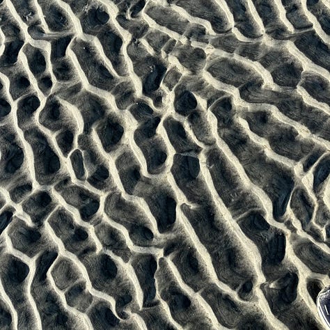 three views of beach sand with different textures and patterns made by water and wind