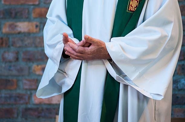 praying priest - priest stock pictures, royalty-free photos & images