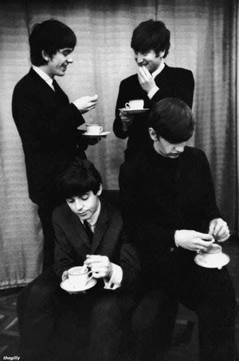 This may contain: the beatles are drinking coffee and talking to each other This may contain: the beatles are drinking coffee and talking to each other