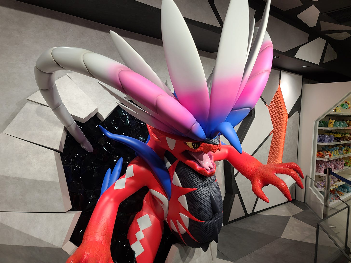 This impressive Koraidon statue looks like its jumping right out of the wall in the Osaka Pokémon Center store This impressive Koraidon statue looks like its jumping right out of the wall in the Osaka Pokémon Center store