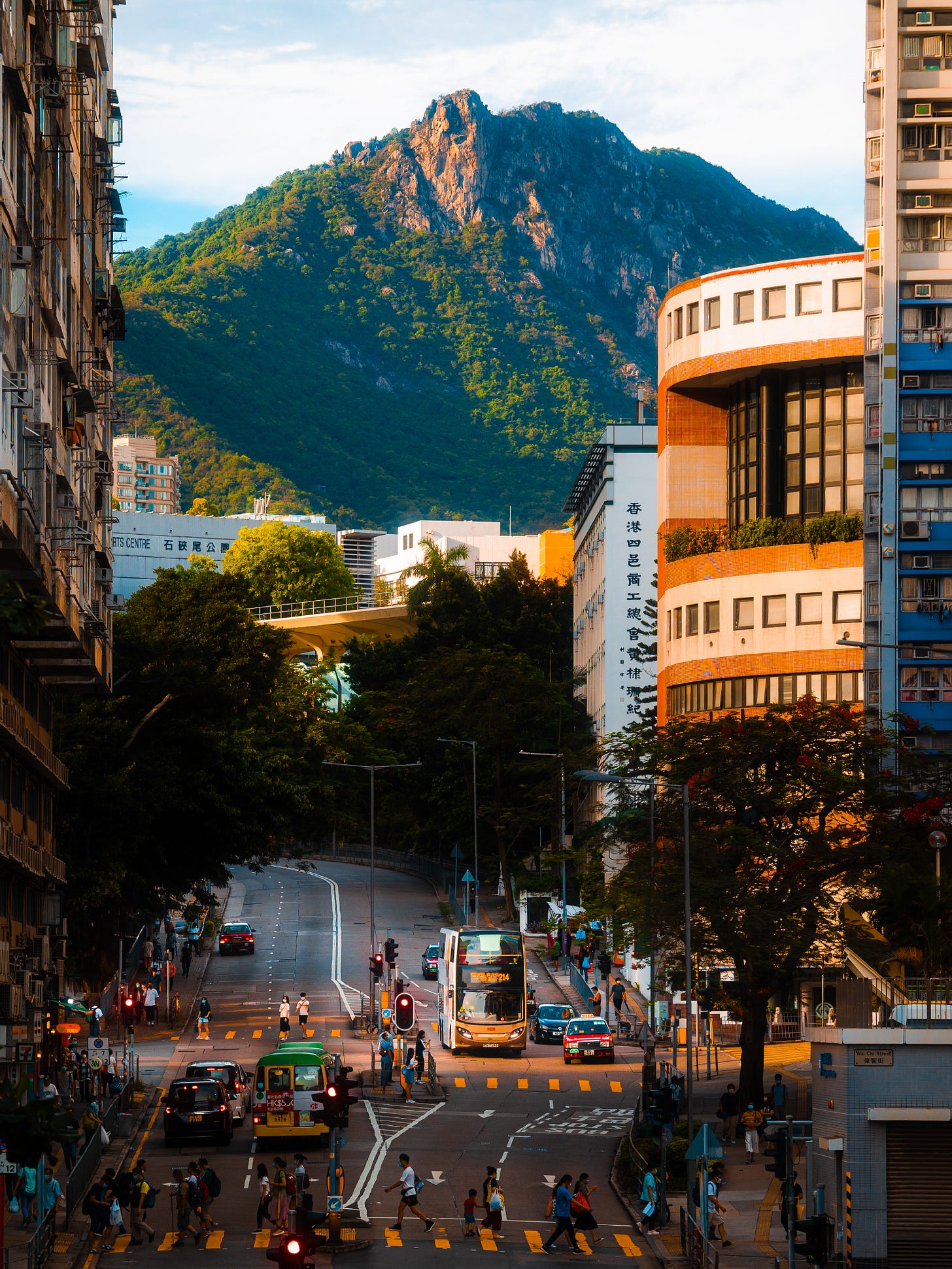 Lion Rock seen from Shek Kip Mei, Hong Kong, at golden hour with urban traffic below Lion Rock seen from Shek Kip Mei, Hong Kong, at golden hour with urban traffic below