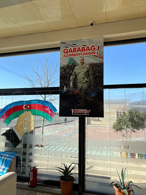 A patriotic roadside diner, and an Iranian village viewed from the roadside.