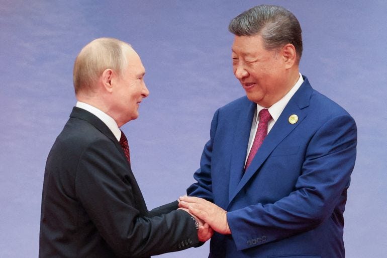 Chinese President Xi Jinping welcomes Russian President Vladimir Putin Chinese President Xi Jinping welcomes Russian President Vladimir Putin