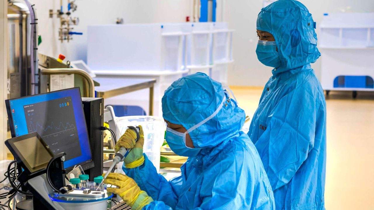 Technicians perform protein testing on the COVID-19 vaccine ReCOV at the Reco Biological Workshop in Taizhou, Jiangsu province, China, December 23, 2021. 