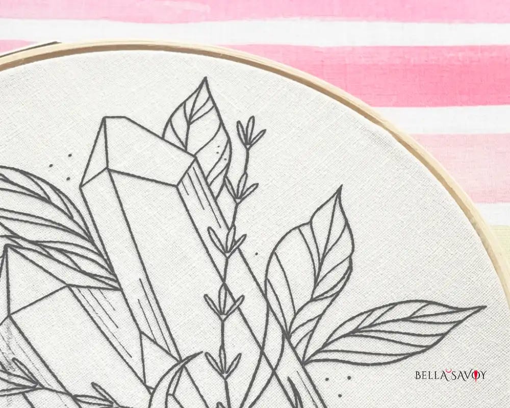 crystal and leaves embroidery pattern transferred onto fabric on a hoop