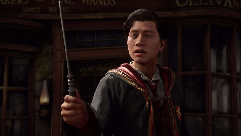 A wizard in Harry Potter Legacy holding a wand A wizard in Harry Potter Legacy holding a wand