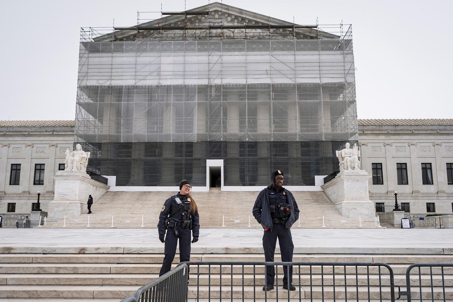 U.S. Supreme Court police officers stand in front of the Supreme Court on Monday. (AP Photo/J. Scott Applewhite)