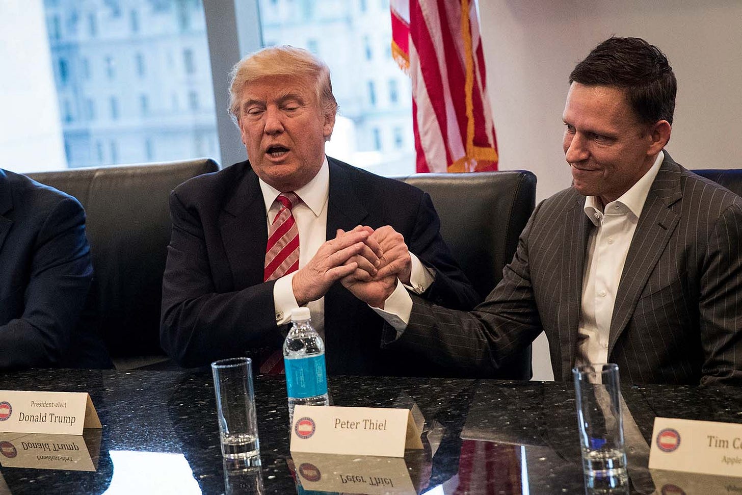 President-elect Donald Trump shakes the hand of Peter Thiel during a meeting with technology executives at Trump Tower, December 14, 2016 in New York City. 