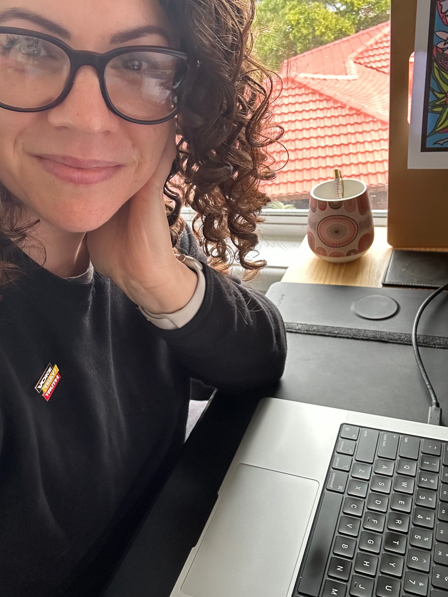 Me in front of my computer with a big smile on my face.