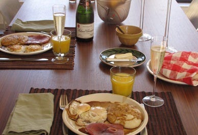 The table set and ready for breakfast. The table set and ready for breakfast.