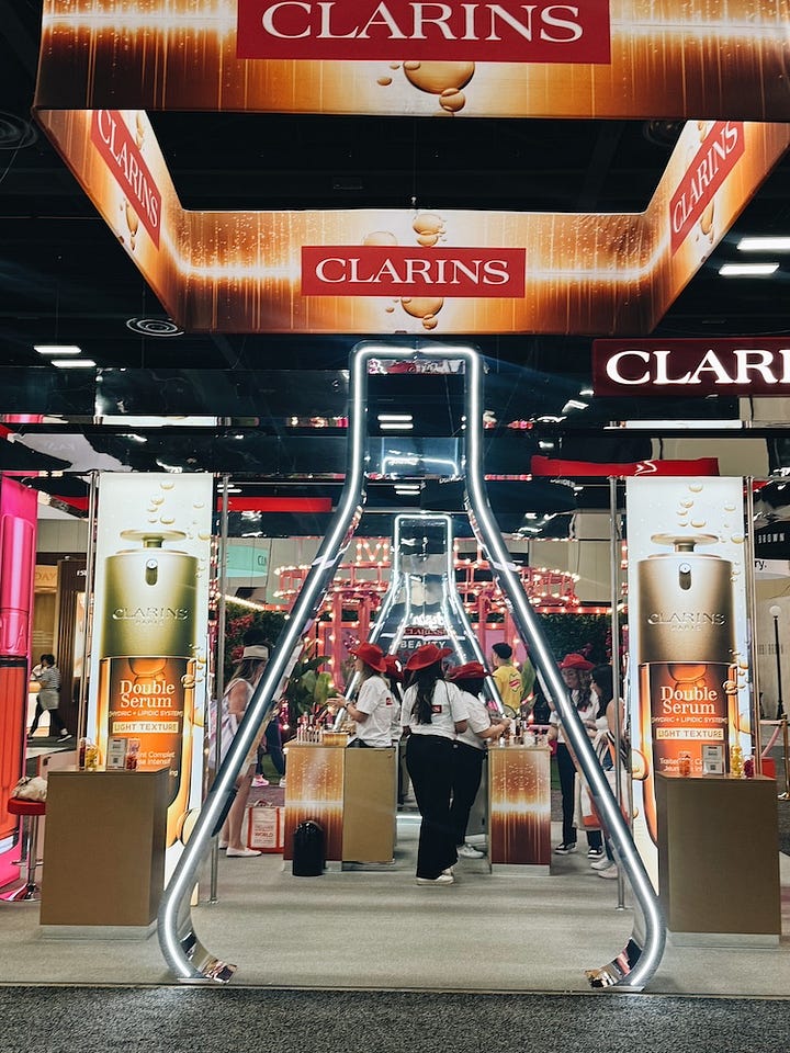 The Supergoop and Clarins booths at Ulta Beauty World