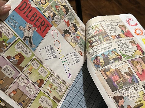 Comic strips from the Sunday paper cut out and glued to pieces of printer paper and then held together by binder clips. The front cover is a manila piece of cardstock with colorful lettering: "Comics of all my favorite comics"