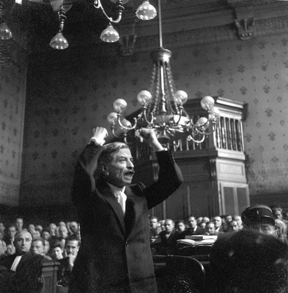 Pierre Laval, former Vichy French Prime Minister, passionately defends himself during his treason trial at the Palais de Justice, Paris, August 1945. He was found guilty and executed in October. Pierre Laval, former Vichy French Prime Minister, passionately defends himself during his treason trial at the Palais de Justice, Paris, August 1945. He was found guilty and executed in October.