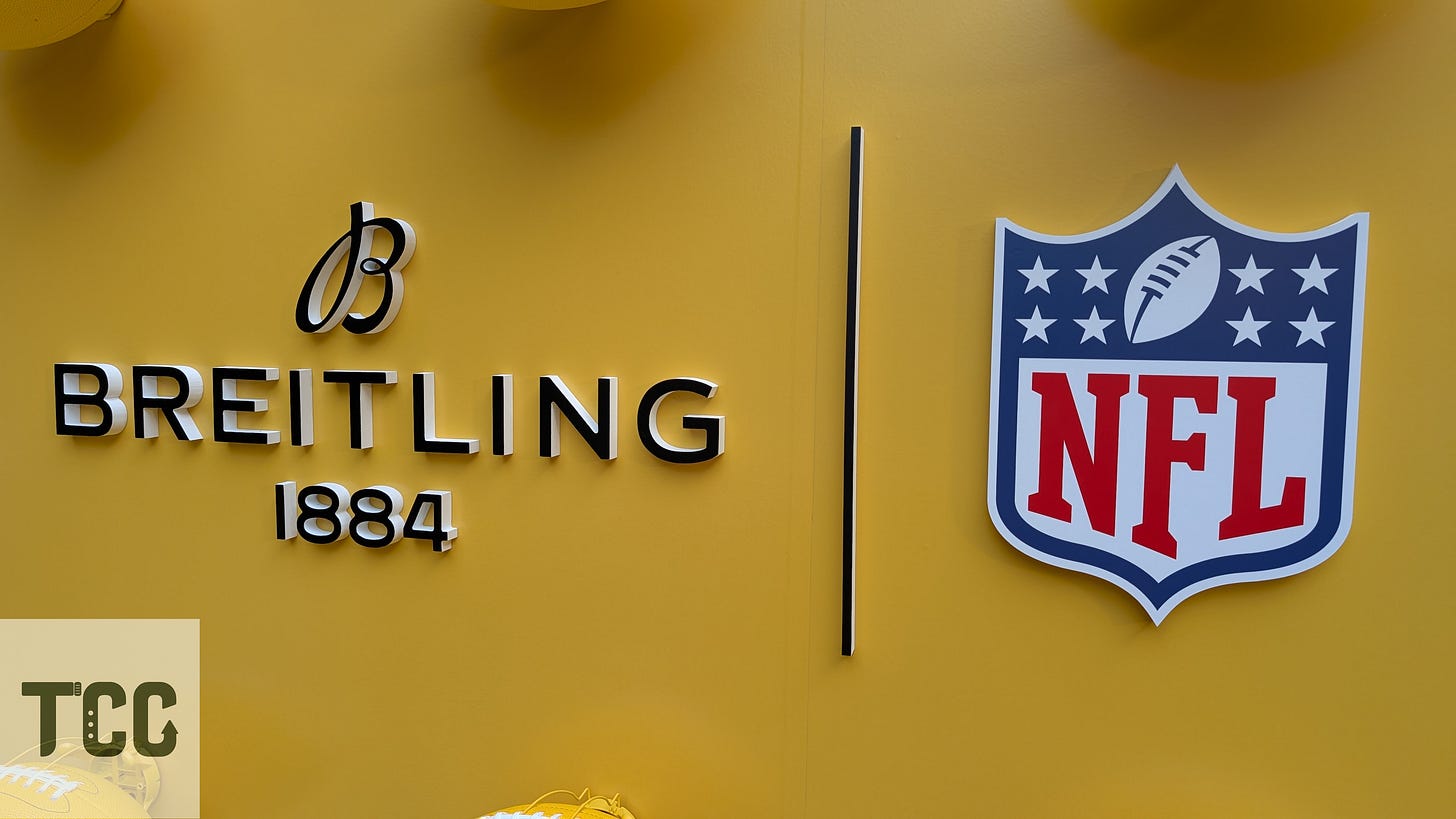 A bold yellow display wall featuring the Breitling logo (est. 1884) on the left and the official NFL shield on the right, signaling the new partnership between the Swiss watchmaker and the American football league.