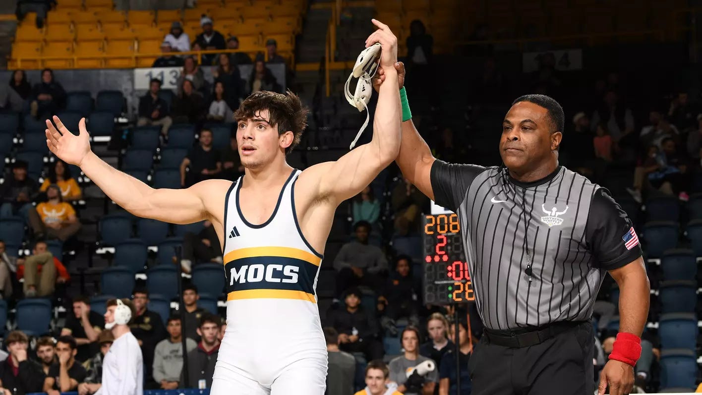 Sergio Desiante's hand is raised as the 174 champion at the Southern Scuffle