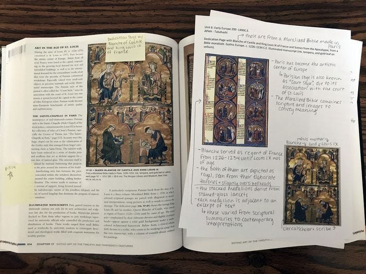 This may contain: an open book with pictures of people and text on the page, sitting on top of a wooden table