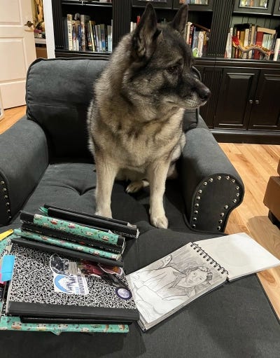 Thora, the Writer Elkhound, gazes regally to one side.
