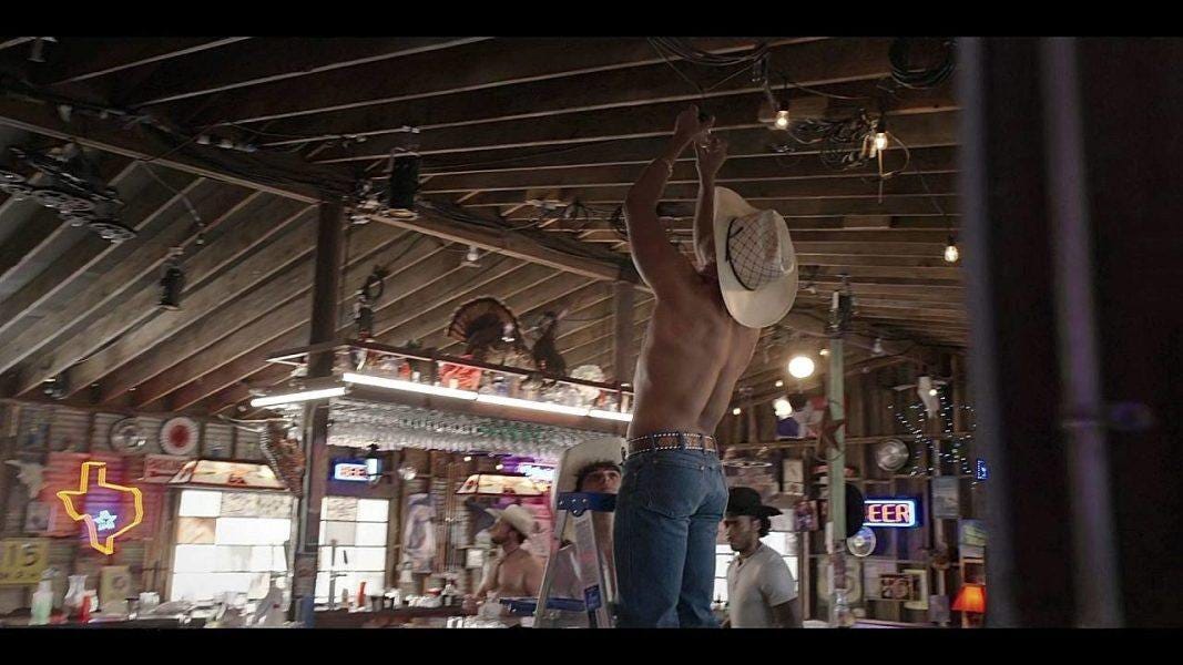 Walker sexy rearview shot of shirtless cowboy reaching up to change lightbulbs. Walker sexy rearview shot of shirtless cowboy reaching up to change lightbulbs.