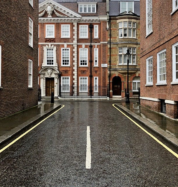 Wet, rainy street corner in London, UK